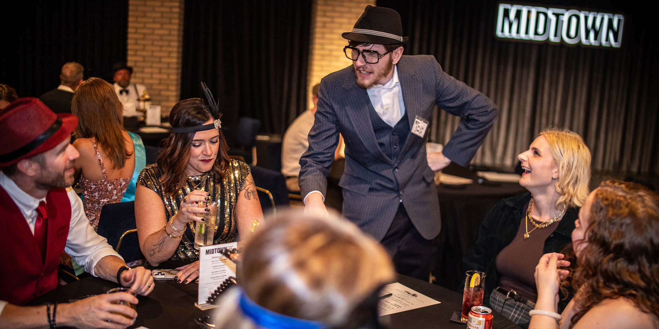 Guests at a Murder Mystery Company public dinner show in Portland