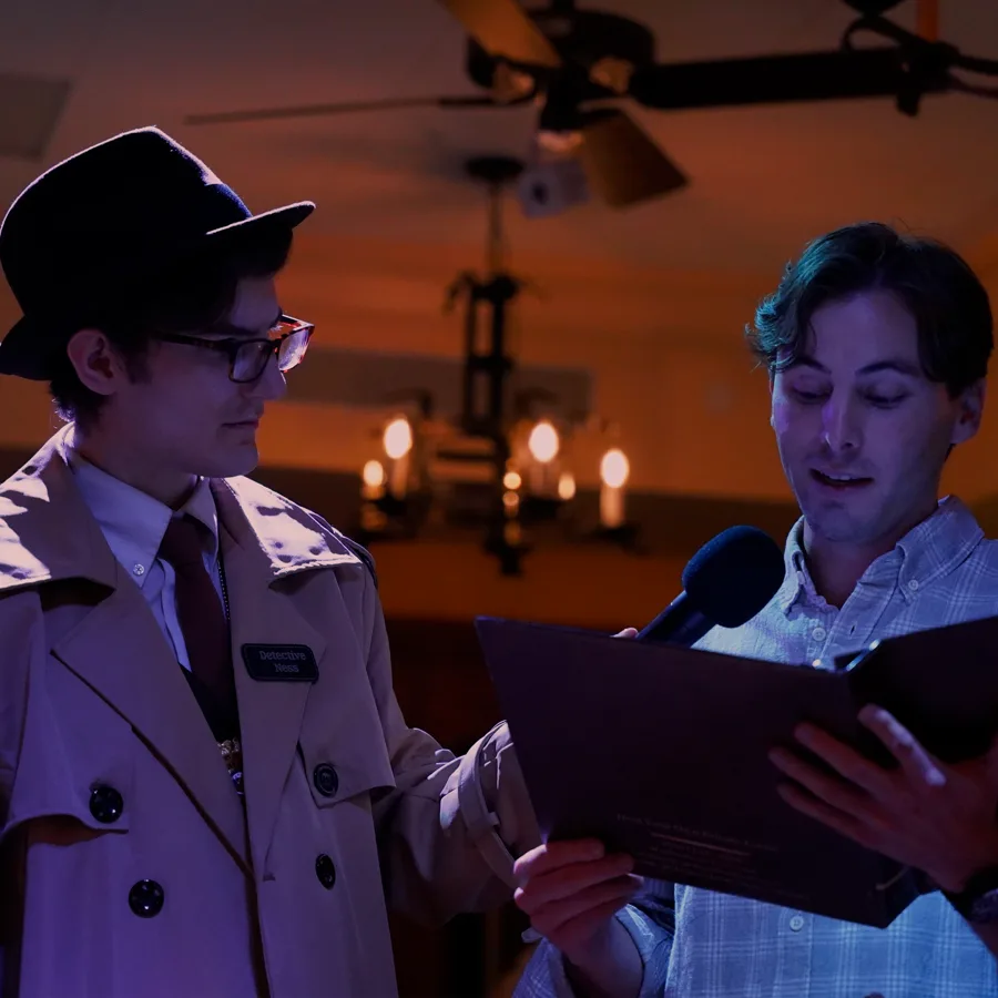 Professional actors performing at a Portland murder mystery